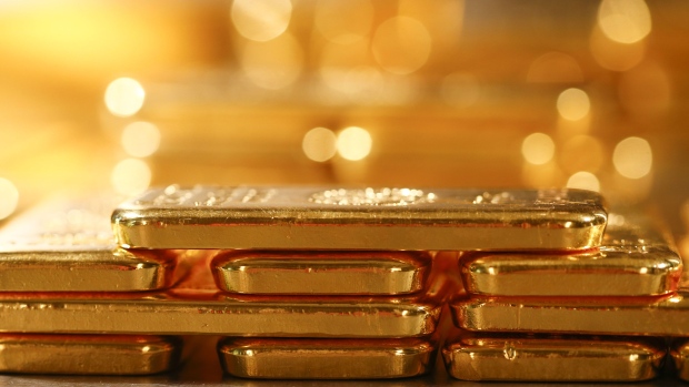 One kilogram fine gold bars sit stacked in the precious metals vault at Pro Aurum KG in Munich, Germany, on Wednesday, July 10, 2019. Gold rose for a third day after the Federal Reserve indicated that it’s preparing to cut interest rates for the first time in a decade as the global economy slows. 