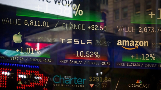 A monitor displays Tesla Inc. signage at the Nasdaq MarketSite in New York, U.S., on Friday, Jan. 18, 2019. Stocks rose to the highest level in more than a month as signs the U.S. and China are closing in on a trade truce and stronger factory numbers boosted investor confidence in the global economy. 