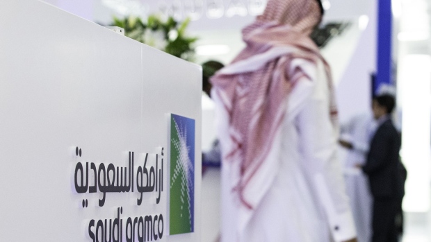 A Saudi Aramco logo sits on display during the Abu Dhabi International Petroleum Exhibition & Conference (ADIPEC) in Abu Dhabi, United Arab Emirates, on Tuesday, Nov. 13, 2018. OPEC’s secretary-general, energy ministers from Saudi Arabia to Russia, CEOs at oil majors from Total SA, BP Plc and Eni SpA, and officials from Middle Eastern energy giants such as Abu Dhabi’s Adnoc have gathered to sign deals and discuss oil, gas, refining and petrochemical issues. 