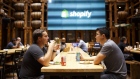 Employees work at the Shopify Inc. office in Waterloo, Ontario, Canada, on Thursday, Sept. 13, 2018. Shopify Plus, the company's highest-tiered subscription, is attracting migrations from other platforms. In 2Q, more than 50% of customers that were added to the service were new to the Shopify platform. 