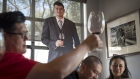 Patrons taste wine inside the Yao Family Wines tasting room in St. Helena, California, U.S.