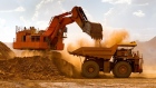 A haul truck is loaded by a digger with material from the pit at Rio Tinto Group's West Angelas iron ore mine in Pilbara, Australia, on Sunday, Feb. 19, 2012. 