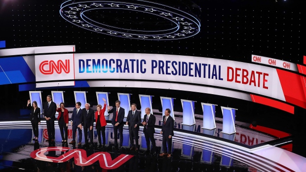 Democratic presidential candidates Marianne Williamson, (L-R), Rep. Tim Ryan (D-OH), Sen. Amy Klobuchar (D-MN), Indiana Mayor Pete Buttigieg, Sen. Bernie Sanders (I-VT), Sen. Elizabeth Warren (D-MA), former Texas congressman Beto O'Rourke, former Colorado governor John Hickenlooper, former Maryland congressman John Delaney, and Montana Gov. Steve Bullock take the stage at the beginning of the Democratic Presidential Debate at the Fox Theatre July 30, 2019 in Detroit, Michigan. 20 Democratic presidential candidates were split into two groups of 10 to take part in the debate sponsored by CNN held over two nights at Detroit’s Fox Theatre.