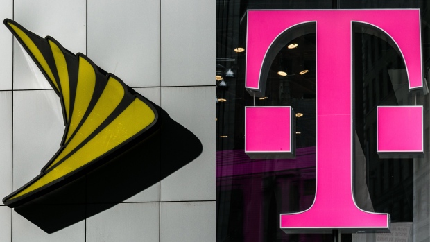 A Sprint Corp. logo is displayed on the exterior of a store location in New York, U.S. on Monday, April 30, 2018. Sprint Corp. suffered its worst stock decline in almost six months, rocked by fears that a proposed $26.5 billion takeover by T-Mobile US Inc. will get rejected by antitrust enforcers. 