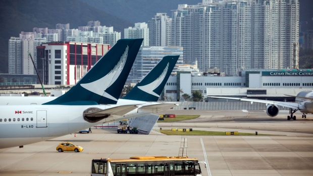 Cathay Pacific Airways Ltd. tail fins are seen at Hong Kong International Airport in Hong Kong, China, on Tuesday, March 5, 2019. Cathay is in talks to buy shares in Hong Kong’s only budget airline Hong Kong Express from Chinese conglomerate HNA Group Co., as Asia’s biggest international carrier seeks to gain a foothold in the region’s booming low-cost travel market. 