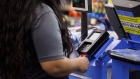 A customer inserts a chip debit card into a credit card terminal at a Wal-Mart Stores Inc. location in Burbank, California, U.S., on Thursday, Nov. 16, 2017. 