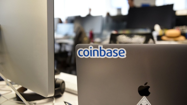 A Coinbase Inc. sticker is seen on a laptop computer at the company's office in San Francisco, California, U.S., on Friday, Dec. 1, 2017. Coinbase wants to use digital money to reinvent finance. In the company's version of the future, loans, venture capital, money transfers, accounts receivable and stock trading can all be done with electronic currency, using Coinbase instead of banks. 