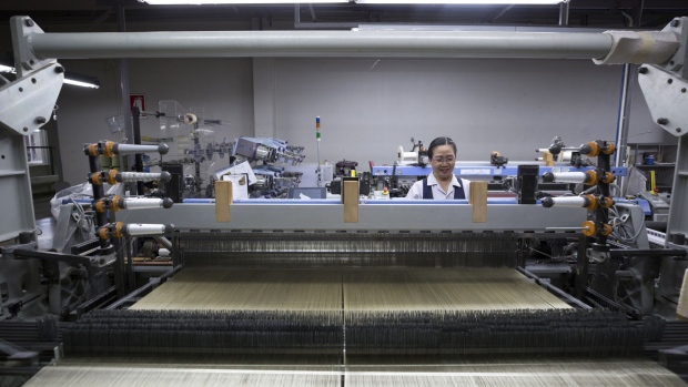 An employee monitors a weaving machine at a factory of Thai Silk Co., manufacturer of Jim Thompson brand products, in Pak Thong Chai in Nakhon Ratchasima Province, Thailand, on Wednesday, May 8, 2019. Thailand is scheduled to release manufacturing purchasing managers' index (PMI) figures on June 3. 