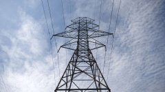 Power lines run through a Hydro One Ltd. transmission tower in Toronto, Ontario, Canada, on Thursday, July 12, 2018. Hydro One is facing a long-term share overhang after new Ontario Premier Doug Ford fulfilled an election promise to oust the utility's chief executive offer and board of directors, analysts say. 