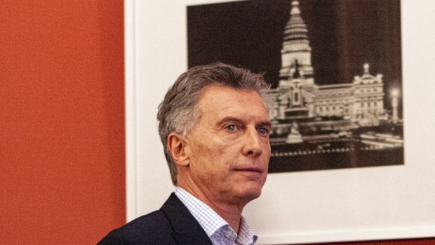 Mauricio Macri, Argentina's president, right, and Miguel Angel Pichetto, the leader of Peronism in Argentina's Senate, arrive for a press conference at the Presidential Palace (Casa Rosada) in Buenos Aires, Argentina, on Monday, Aug. 12, 2019. The cost of hedging Argentina’s sovereign debt against losses soared to a multi-year high Monday after President Mauricio Macri was unexpectedly defeated by a landslide in a primary vote. 