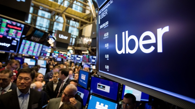 A monitor displays Uber Technologies Inc. signage during the company's initial public offering (IPO) on the floor of the New York Stock Exchange (NYSE) in New York, U.S., on Friday, May 10, 2019. The No. 1 ride-hailing company's shares will start trading on the New York Stock Exchange after it raised $8.1 billion in the biggest U.S. IPO since 2014, pricing shares at $45 each. 