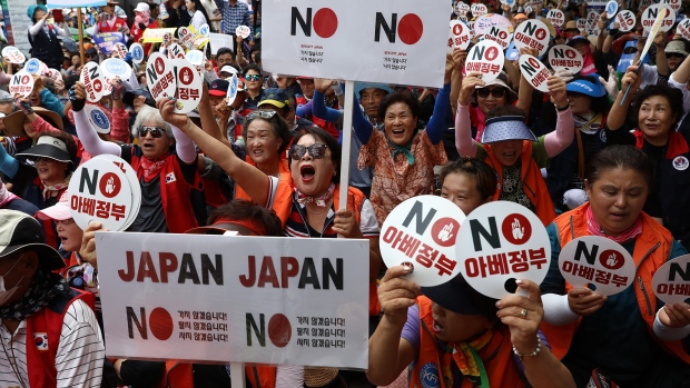 South Koreans participate in a rally to denounce Japan's new trade restrictions on South Korea in Seoul on Aug. 13, 2019.