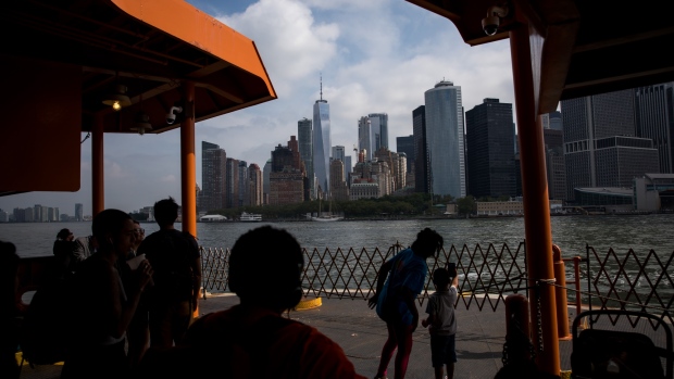 Commuters ride the Staten Island Ferry to Lower Manhattan in New York, U.S., on Friday, July 5, 2019. U.S. stocks fell from records, Treasuries tumbled and the dollar jumped after a strong monthly jobs report clouded the case for Federal Reserve rate cuts. 