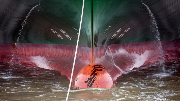 Water breaks around the stern of the CSCL Indian Ocean container ship, operated by China COSCO Shipping Corp Ltd., towards the dockside at the Port of Felixstowe Ltd., a subsidiary of CK Hutchison Holdings Ltd., in Felixstowe, U.K., on Friday, March 22, 2019. Container terminals including Felixstowe, Southampton, London and Teesport stand to benefit from a no-deal Brexit because, unlike ferry ports, their reliance on traffic from Asia and the Americas means they’re already geared up for the customs checks that could accompany a no-deal split. 