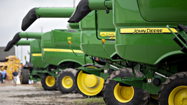 Deere & Co. John Deere combine harvesters sit on display during the Farm Progress Show in Boone, Iowa, U.S., on Tuesday, Aug. 28, 2018. The show, sponsored by Farm Progress Co. and owned by Penton Media, is billed as the largest outdoor farm show in the U.S. 