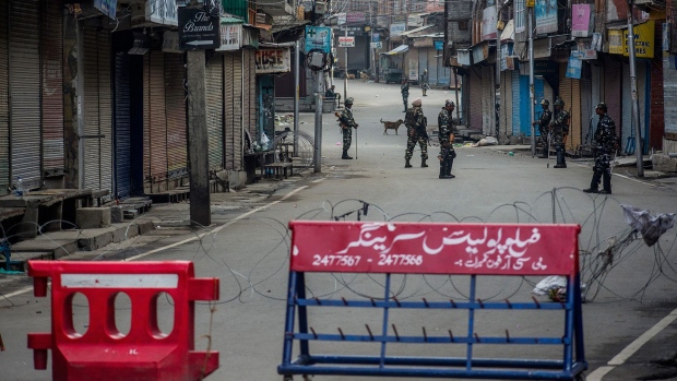 Indian government forces stand guard in the city center on Aug. 15, 2019 in Srinagar, the summer capital of Indian administered Kashmir, India.