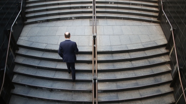 A man walks up a flight of stairs at Martin Place in Sydney, Australia, on Thursday, Aug. 17, 2017. Australian employers added more jobs than forecast in July, underscoring the central bank’s confidence in an improving labor market. 