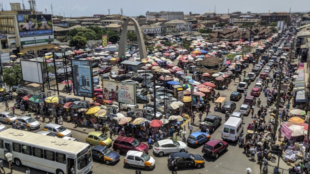 Heavy automobile traffic passes by Makola market in Accra, Ghana, on Thursday, March 15, 2018. Ghana wants to shake up the way it collects tax with the International Monetary Fund telling the government that it’s not raising sufficient income. 