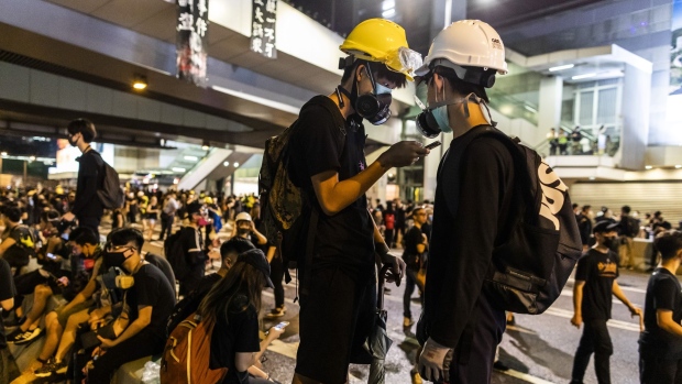 Demonstrators march during a protest in Sha Tin on July 14. Photographer: Paul Yeung/Bloomberg