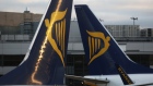Tail fins of Ryanair Holdings Plc aircraft stand next to each other at Dublin Airport, operated by Dublin Airport Authority, in Dublin, Ireland, on Friday, Nov. 25, 2016. Ryanair provides low fare passenger airline services to destinations in Europe. 