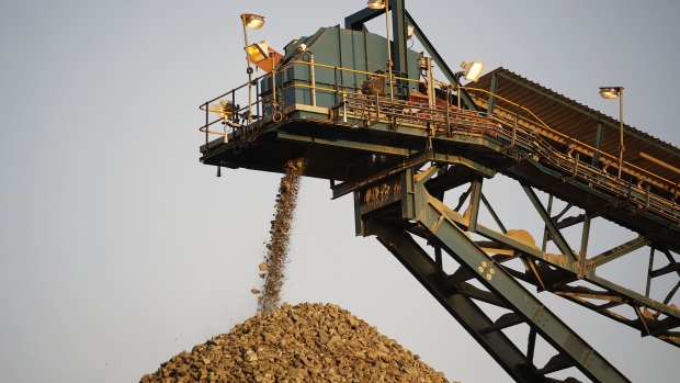 A conveyor belt deposits processed rock ore onto a dump at the Kibali gold mine, operated by Randgold Resources Ltd., in Kibali, Democratic Republic of Congo, on Saturday, Oct. 18, 2014. Randgold and AngloGold Ashanti Ltd. gained control of the Kibali mine by acquiring Moto Goldmines Ltd. in 2009 and is forecast to produce about 600,000 ounces of gold a year. 