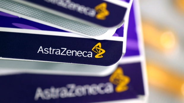 The AstraZeneca Plc company logo is seen on boxes of pharmaceutical products produced by the company in this arranged photograph taken in London, U.K. 