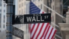 A Wall Street sign is displayed in front of the New York Stock Exchange (NYSE) in New York, U.S., on Friday, May 25, 2018.
