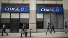 Pedestrians pass in front of a JPMorgan Chase & Co. bank branch in New York, U.S., on Tuesday, July 2, 2019. JPMorgan Chase & Co. is scheduled to release earnings figures on July 16. 