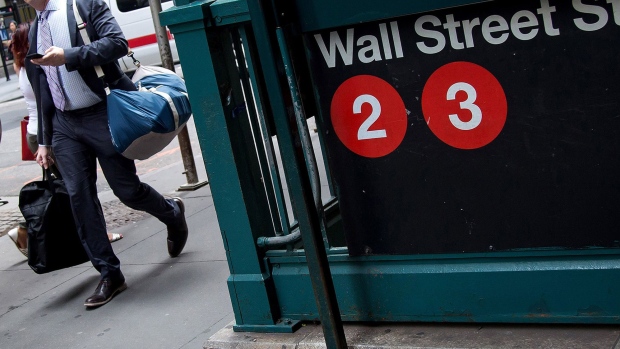 A pedestrian walks past the Wall Street subway station near New York Stock Exchange. 