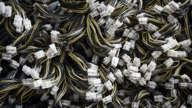 Cables for bitcoin mining machines sit on the floor at a mining facility operated by Bitmain Technologies Ltd. in Ordos, Inner Mongolia, China, on Friday, Aug. 11, 2017. Bitmain is one of the leading producers of bitcoin-mining equipment and also runs Antpool, a processing pool that combines individual miners from China and other countries, in addition to operating one of the largest digital currency mines in the world. 