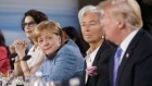 German Chancellor Anglea Merkel and outgoing International Monetary Fund chief Christine Lagarde listen to Trump. Click here for more of Bloomberg’s most compelling political photos from the past week. Photographer:  Cole Burston/Bloomberg