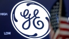 The General Electric logo appears above a trading post on the floor of the New York Stock Exchange
