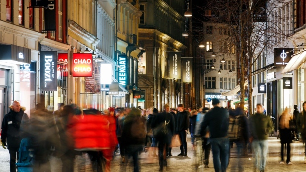 Shoppers walk along the pedestrianized Kobmagergade shopping street in Copenhagen, Denmark, on Wednesday, Jan. 2, 2019. For the first time in almost three years, the central bank of Denmark has bought kroner to support its euro peg through a direct intervention in the currency market. 