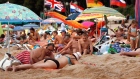 On the beach in Lloret de Mar, Spain. Fewer British visitors means not as many cold brews being downed. Tourists from the U.K. and elsewhere drink around 25% of the beer consumed in Spain annually. Photographer: Cate Gillon/Getty Images Europe