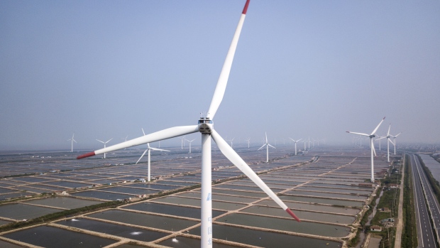 Wind turbines manufactured by Shanghai Electric Group Co. stand at a wind farm operated by China Huaneng Group in this aerial photograph taken in Qidong, China, on Thursday, June 7, 2018.