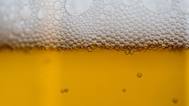 Bubbles, produced by carbon dioxide, float to the top of a glass of lager in this arranged photograph in London, U.K., on Thursday, July 5, 2018. Breweries across northern Europe are fretting about shortages of beer because of a short supply of carbon dioxide due to a high number of closures at ammonia plants that produce CO2. 