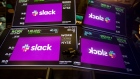 Monitor displays Slack Technologies Inc. signage during the company's initial public offering (IPO) on the floor of the New York Stock Exchange (NYSE) in New York, U.S., on Thursday, June 20, 2019. Following in the footsteps of music-streaming service Spotify Technology SA last year, the workplace messaging application is set to start trading on the New York Stock Exchange Thursday via a direct listing. 