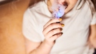 A person smokes a Juul Labs Inc. e-cigarette in this arranged photograph taken in the Brooklyn Borough of New York, U.S., on Thursday, Dec. 20, 2018. 