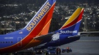 Southwest Airlines Co. Boeing Co. 737 aircrafts taxi on the tarmac at San Francisco International Airport (SFO) in San Francisco, California, U.S., on Wednesday, March 27, 2019. The ban on Boeing 737 Max flights plus soft leisure-travel demand will shave $150 million from Southwest's first-quarter revenue. 