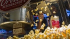A worker scoops popcorn at a concession stand inside a Cinemark Holdings Inc. movie theater in the Playa Vista neighborhood of Los Angeles, California, U.S. 