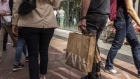 A pedestrian carries a shopping bag from a Zara fashion store, operated by Industria de Diseno Textil SA, in Gothenburg, Sweden, on Saturday, Aug. 24, 2019. The Swedish krona climbed against the dollar for the first time in six days last week after a senior Riksbank official said that inflation outcomes looked "pretty good," fueling expectations of a future rate hike. 