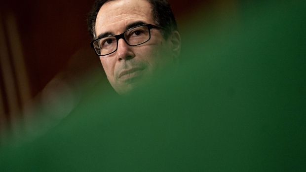 Steven Mnuchin, U.S. Treasury secretary, listens during a Senate Banking Committee hearing in Washington, D.C., U.S., on Tuesday, Sept. 10, 2019. President Donald Trump's point men on housing finance are looking to sell lawmakers on their plan for freeing Fannie Mae and Freddie Mac. Photographer: Andrew Harrer/Bloomberg