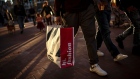 A pedestrian carries a Old Navy Inc. shopping bag in San Francisco, California, March 11, 2019.