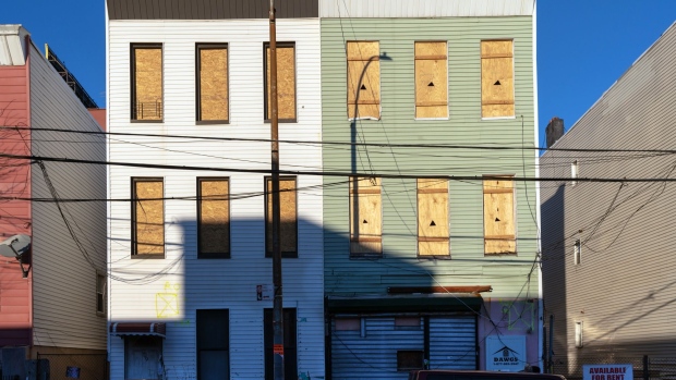 Boarded up residential buildings stand in the Port Morris neighborhood of the Bronx borough of New York, U.S., on Friday, Jan. 11, 2019. For a limited time, investors who develop real estate or fund businesses in opportunity zones are able to defer capital gains on profits earned elsewhere and completely eliminate them on new investments in 8,700 low-income census tracts. The goal is to reinvigorate these areas. 