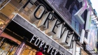 Signage is displayed outside a Forever 21 Inc. store in the Times Square neighborhood of New York, U.S., on Thursday, Aug. 29, 2019. 