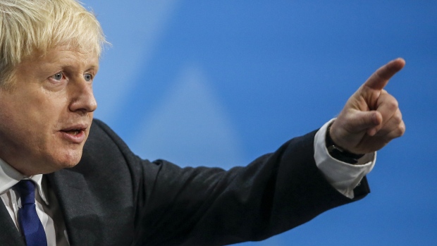 Boris Johnson, former U.K. foreign secretary, gestures during the final Conservative Party leadership hustings held at the ExCel Centre in London, U.K., on Wednesday, July 17, 2019. Boris Johnson and Jeremy Hunt are battling to replace Theresa May as leader of the Conservative Party and British prime minister. 