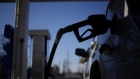 A gasoline pump nozzle refuels a sport utility vehicle (SUV) at the B&N Food Market gas station in Bagdad, Kentucky, U.S., on Wednesday, Feb. 26, 2014. The national unleaded average gasoline price rose to $3.436 per gallon yesterday, according to AAA. 