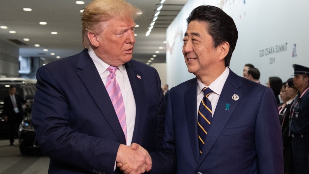 OSAKA, JAPAN - JUNE 28: U.S President Donald Trump is greeted by Japan's Prime Minister, Shinzo Abe, as he arrives on the first day of the G20 summit on June 28, 2019 in Osaka, Japan. 