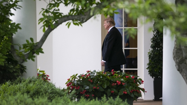 U.S. President Donald Trump walks from the Oval Office before boarding Marine One on the South Lawn of the White House in Washington, D.C., U.S., on Monday, May 20, 2019. 