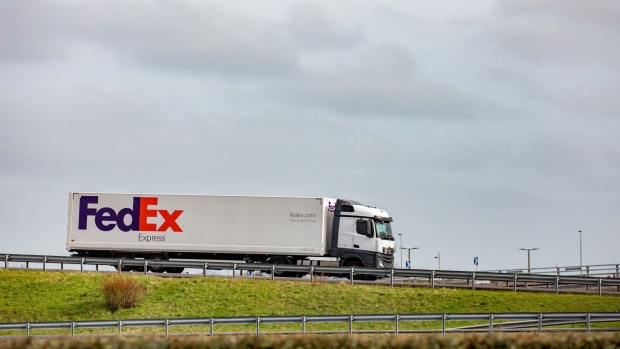 A cargo truck, operated by FedEx Corp., travels on a highway near the French border in Calais, France, on Monday, March 18, 2019. French cabinet last month approved a decree that would keep Eurostar trains running through Eurotunnel's Channel tunnel in the case of a so-called Hard Brexit. 